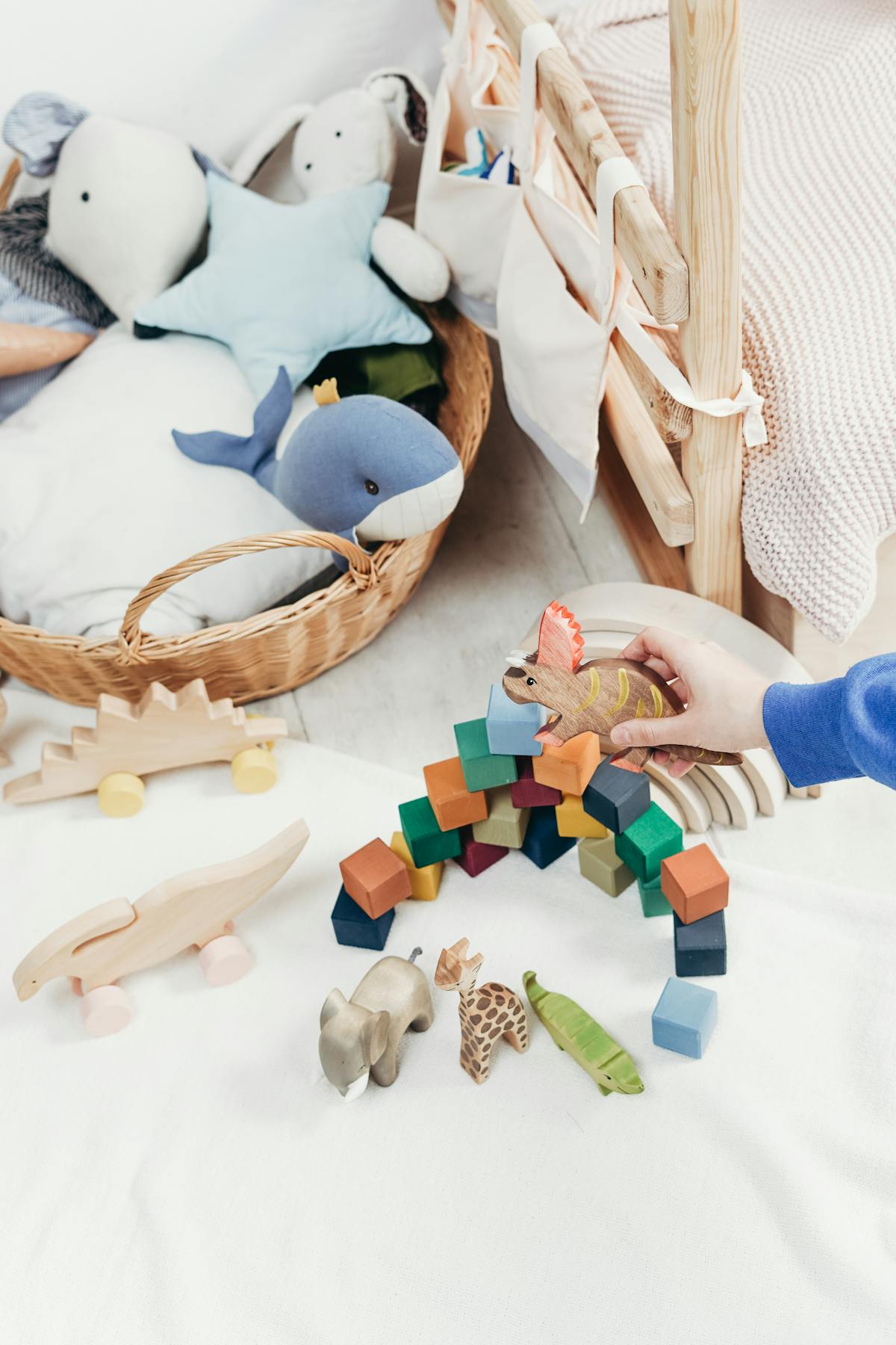 Friendly staff assisting a young child in selecting a toy.